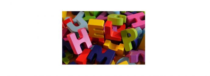 Image shows colourful letter blocks spelling the word "help"