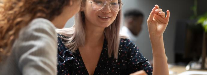A student having a discussion with a professional 