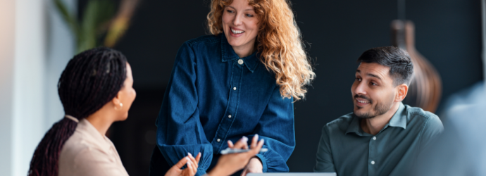 professionals around a table in a meeting
