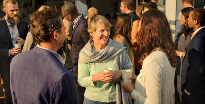 group of people talking outside