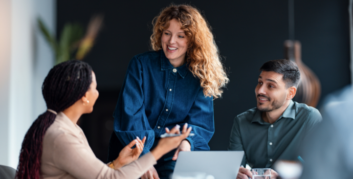 professionals around a table in a meeting