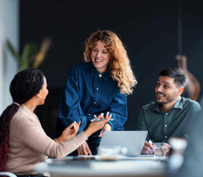 professionals around a table in a meeting