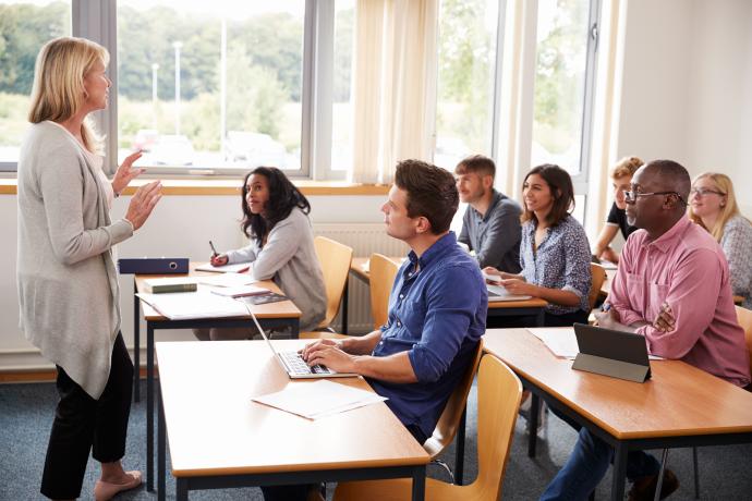 A university or college class of older students being taught by their teacher